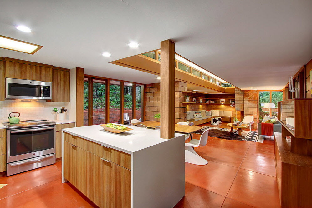 Original Country House Design in Red Color. Kitchen island at the open space cooking area