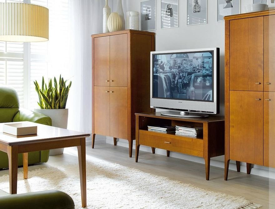 Typical 1980s interior with tv set on the chestboard and two cabinets at both sides