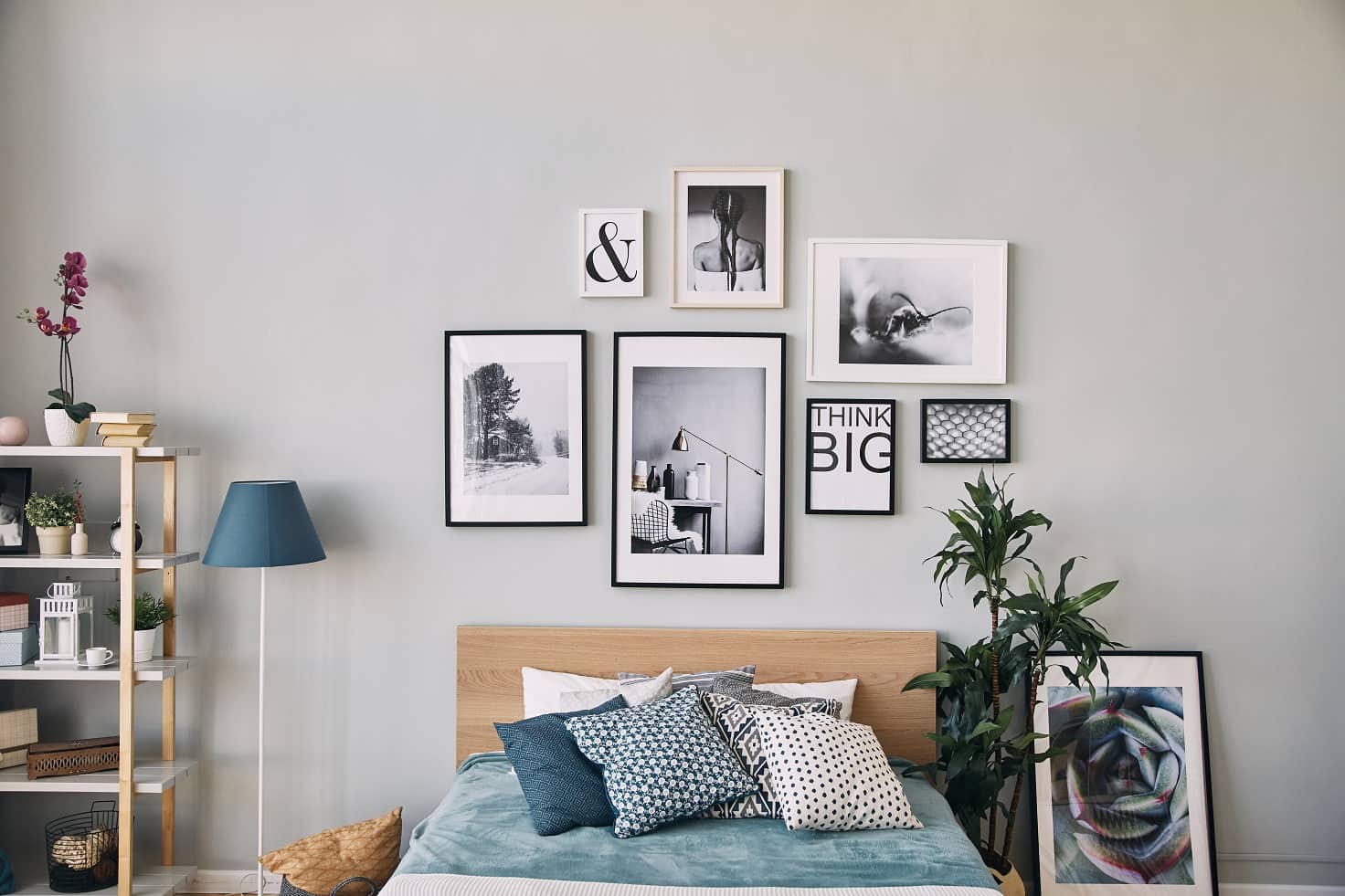 6 Pro Tips To Using Art Prints In Your Home. Pictures in black and white frames to decorate the gray headboard wall